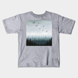Cloudy or misty forest with pine trees and birds Kids T-Shirt